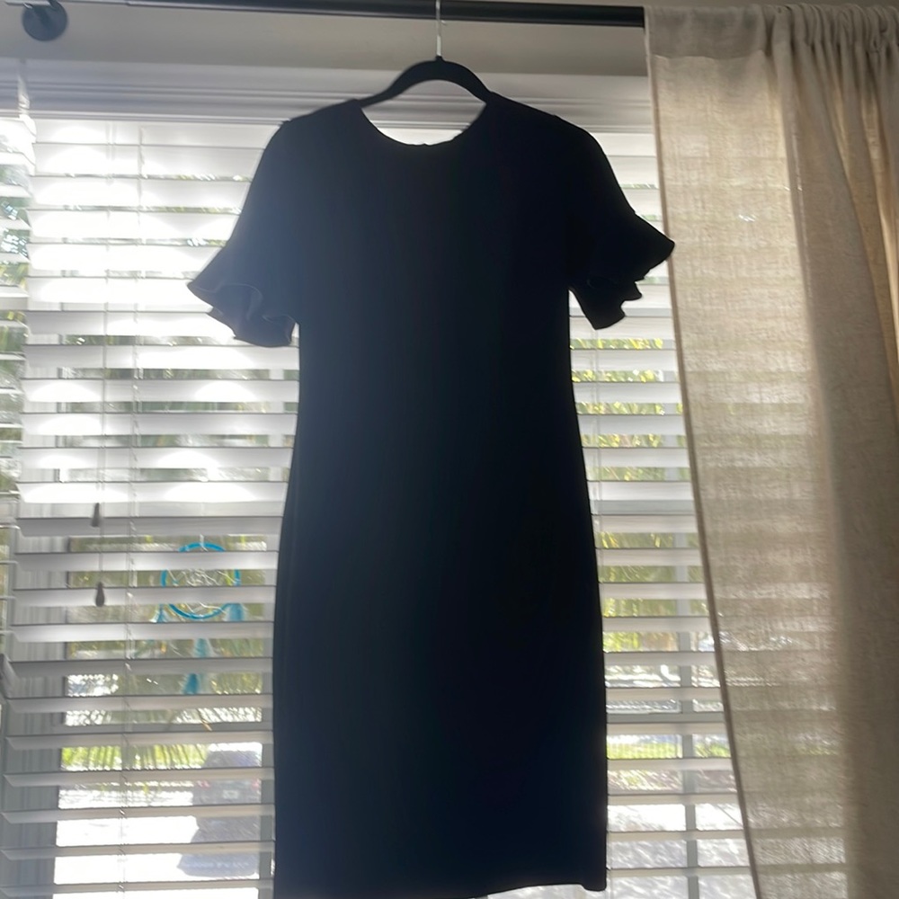 Calvin Klein black dress gold zipper, knee length, ruffled sleeve like new